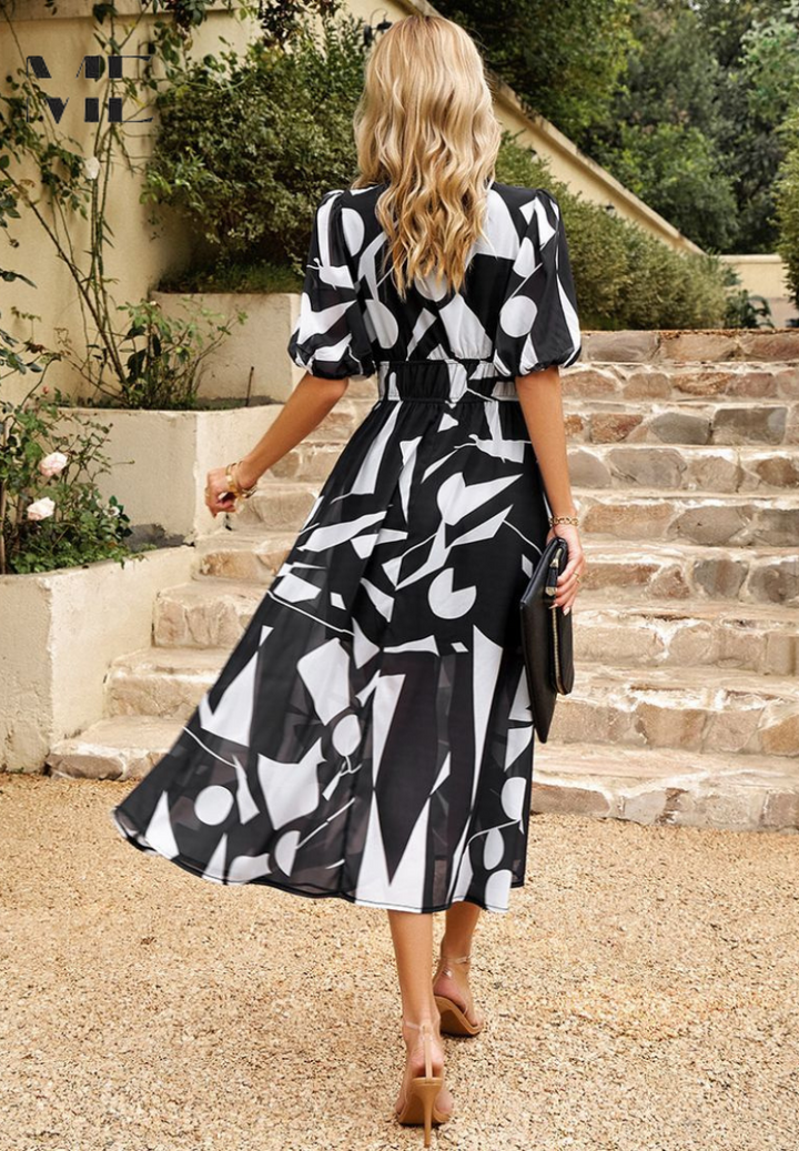 Chic women's floral print party dress. Elegant V-neck midi with puff sleeves & A-line skirt. Perfect for events.