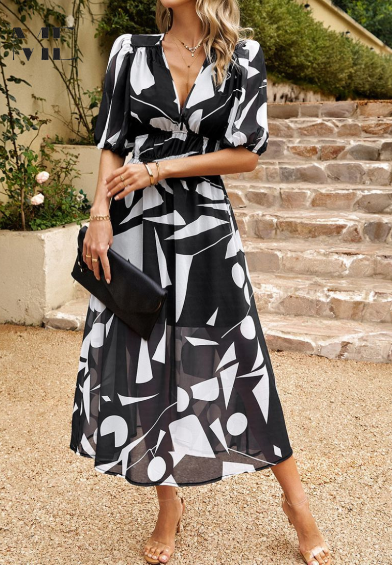 Soft, flowing fabric of women's elegant floral print midi dress. V-neck, puff sleeves, A-line for graceful movement.