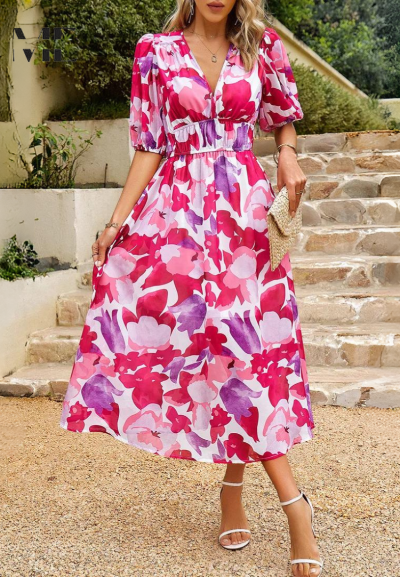 Elegant women's floral print midi dress with prominent puff sleeves. V-neck, A-line, perfect for spring fashion.