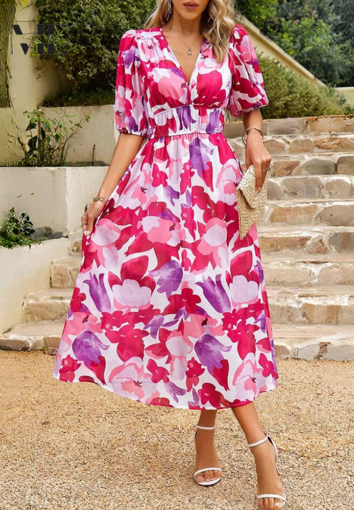 Elegant women's floral print midi dress with prominent puff sleeves. V-neck, A-line, perfect for spring fashion.