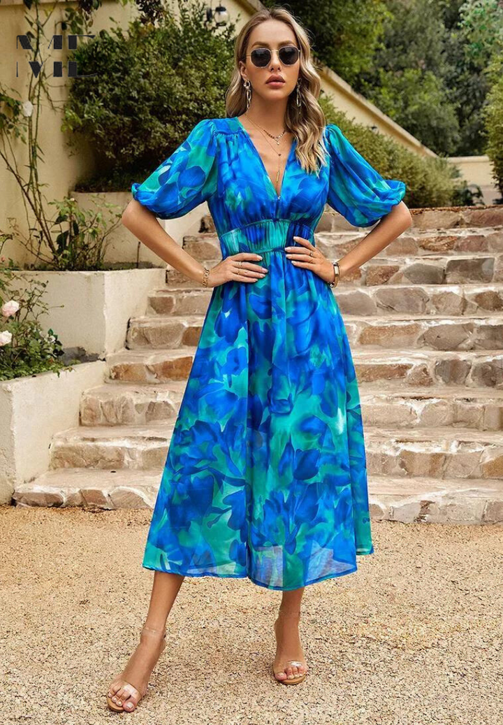Hanging elegant women's floral print midi dress with V-neck, puff sleeves, A-line. Ready for spring/summer wear.
