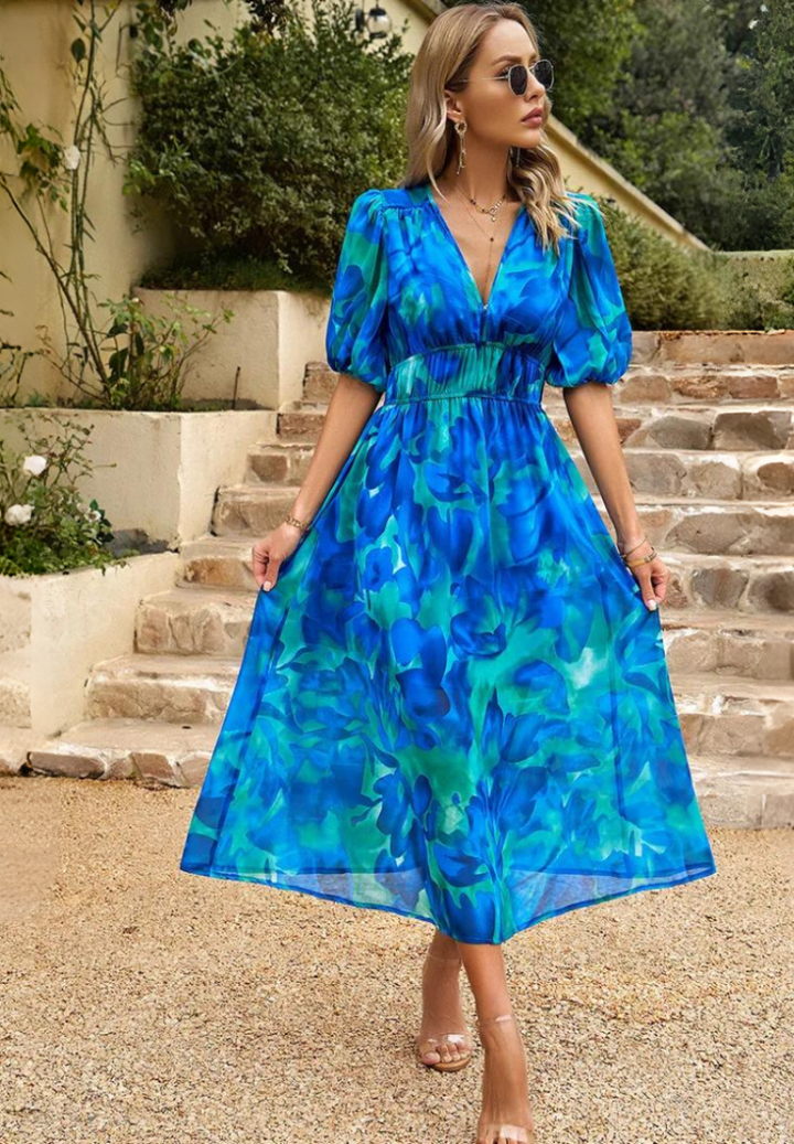 Stylish women's floral print V-neck midi dress with puff sleeves. A-line design, perfect for vacation or party.