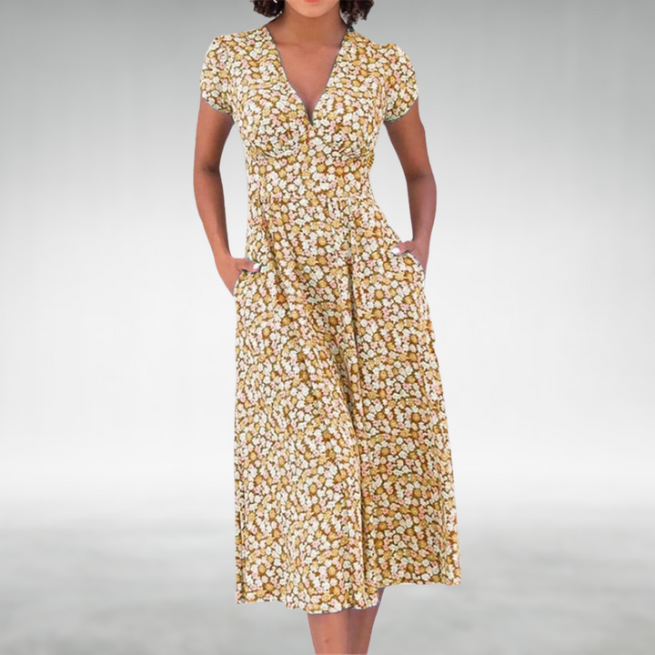 Purple floral V-neck midi dress, women's elegant summer style. Flowy, short-sleeve design for versatile wear.