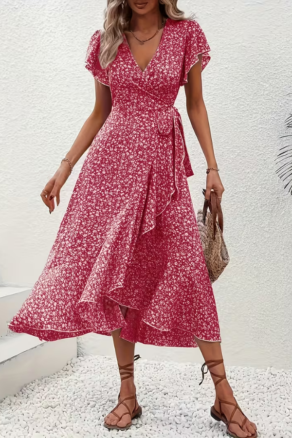 Women's elegant floral V-neck dress, a fitted midi with an asymmetrical hem for sophisticated event wear.