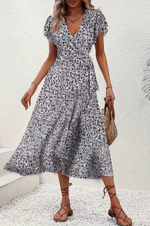 Stylish women's summer floral V-neck midi dress, perfect for a chic and elegant event look.