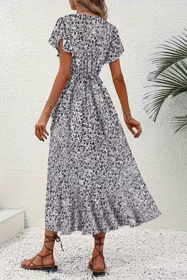 Vibrant floral V-neck short sleeve midi dress for women, offering a flattering and elegant fit.