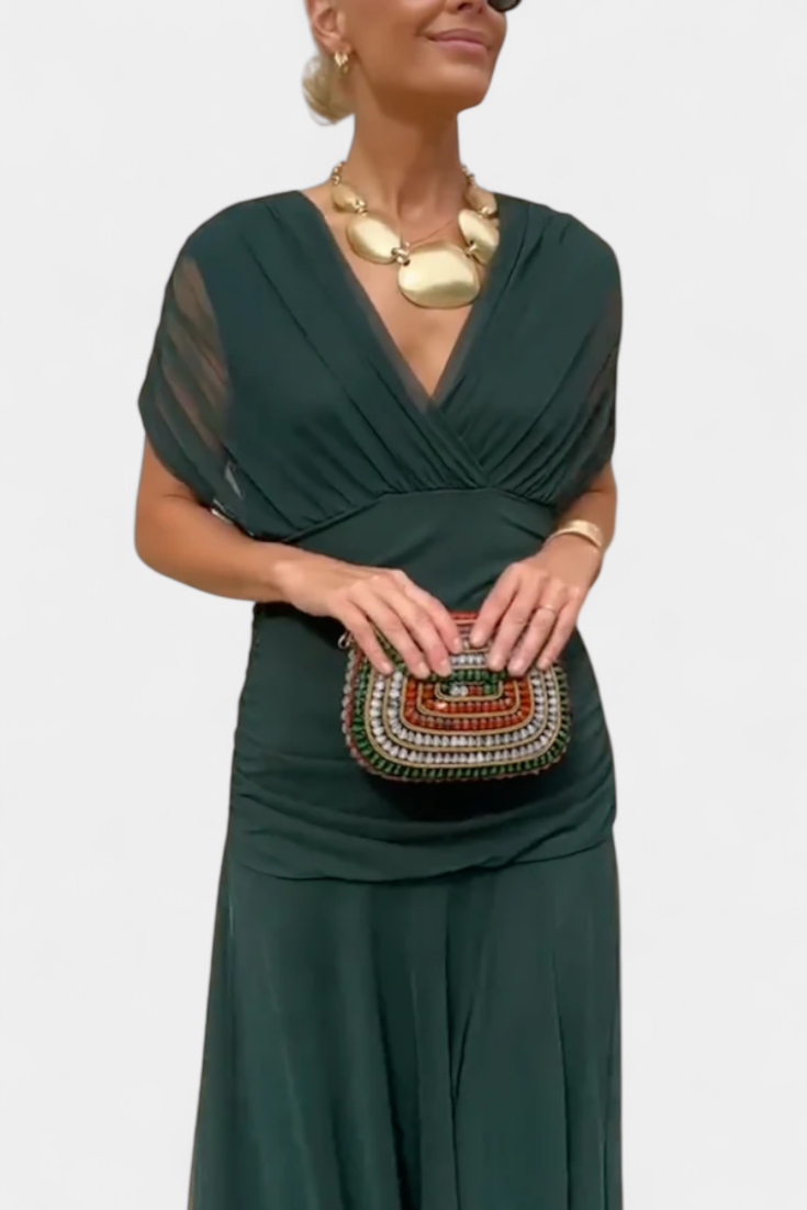 Elegant V-neck floral maxi dress, pleated design for women's evening fashion.