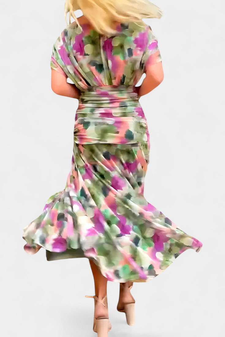 Women's floral V-neck maxi dress with elegant pleats, ideal for parties.