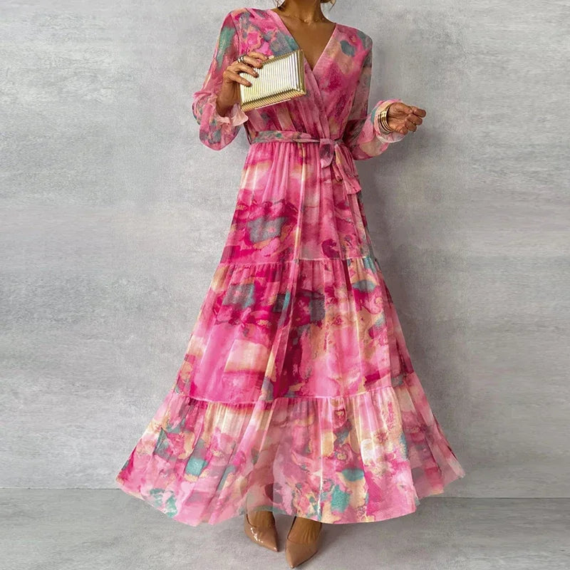 Elegant women's floral V-neck wrap maxi dress, perfect for a wedding guest or summer party. Features long tiered skirt.