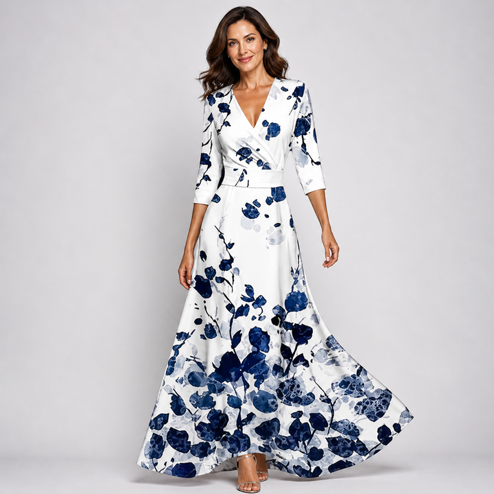 Flowing women's maxi dress with a beautiful floral print and V-neck wrap design, ideal for summer elegance.