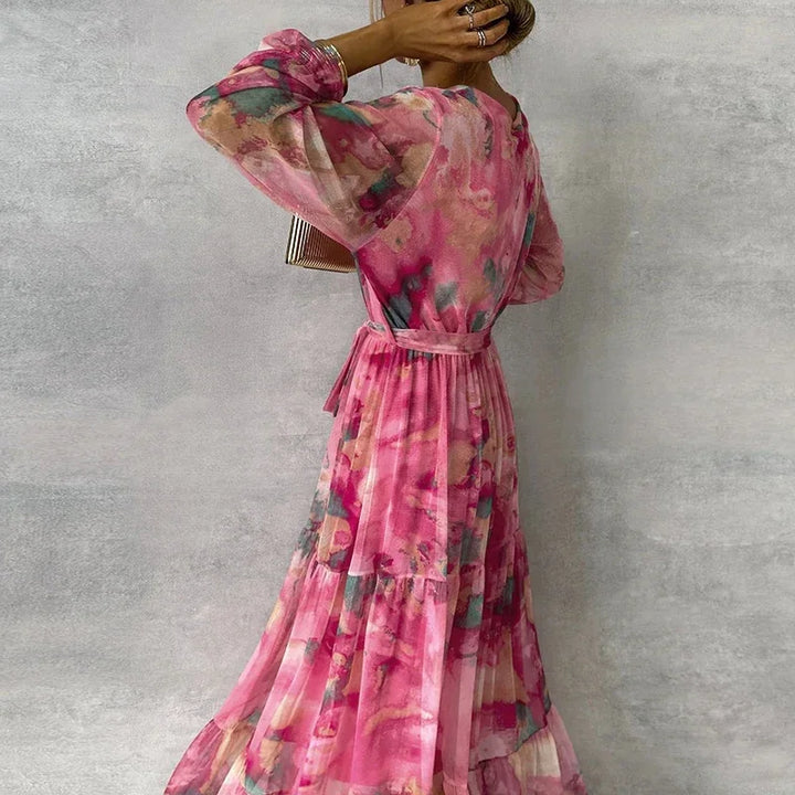 Beautiful women's floral V-neck wrap maxi dress. Elegant long tiered summer party or wedding guest dress with romantic style.