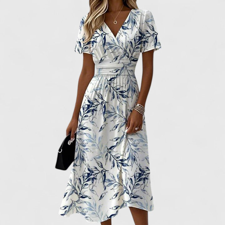 Chic women's midi wrap dress in a vibrant floral print, comfortable V-neck, and short sleeves for summer fashion.