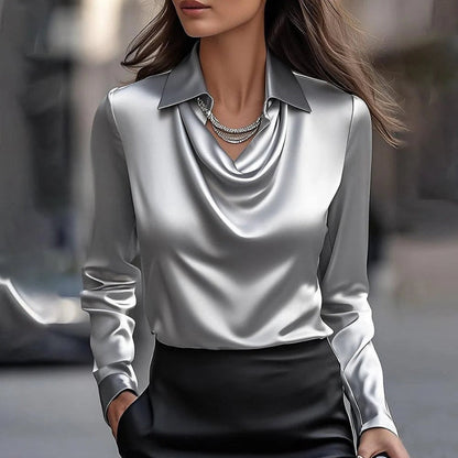 Comfortable women's flowing blouse with long sleeves, offering a versatile and elegant look for office or casual.