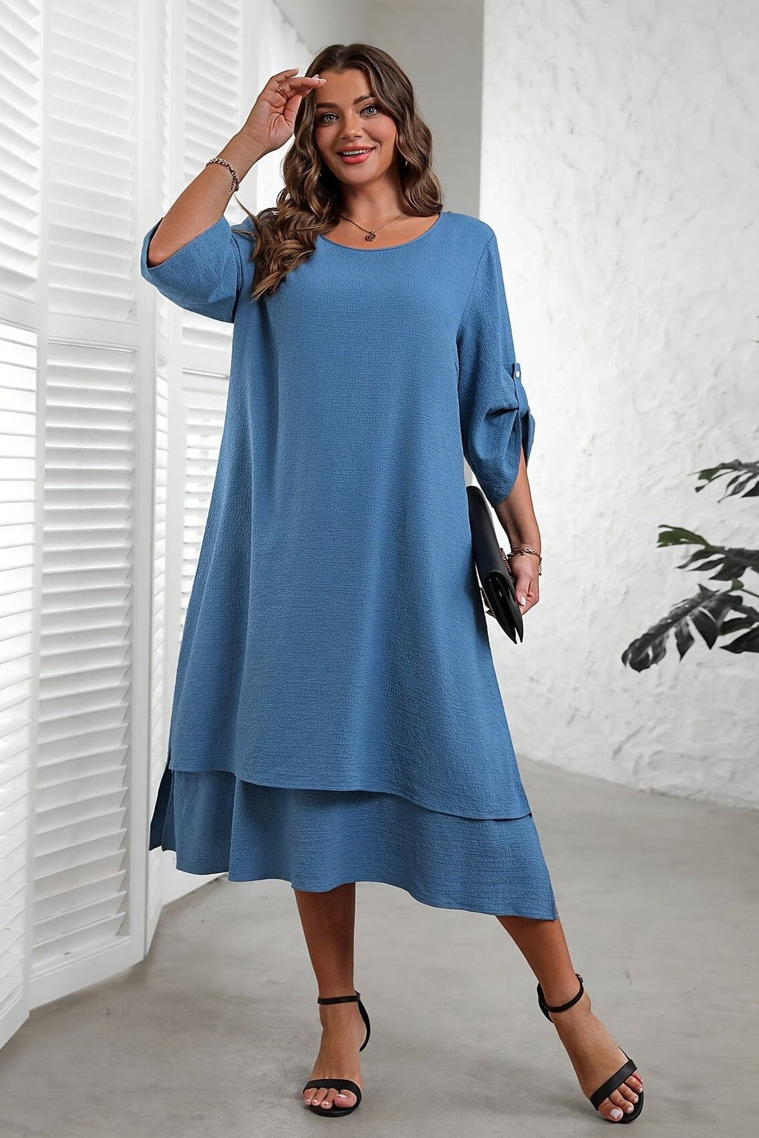 Elegant women's flowing midi dress in a beautiful blue, perfect for versatile day-to-evening style and comfortable fashion.