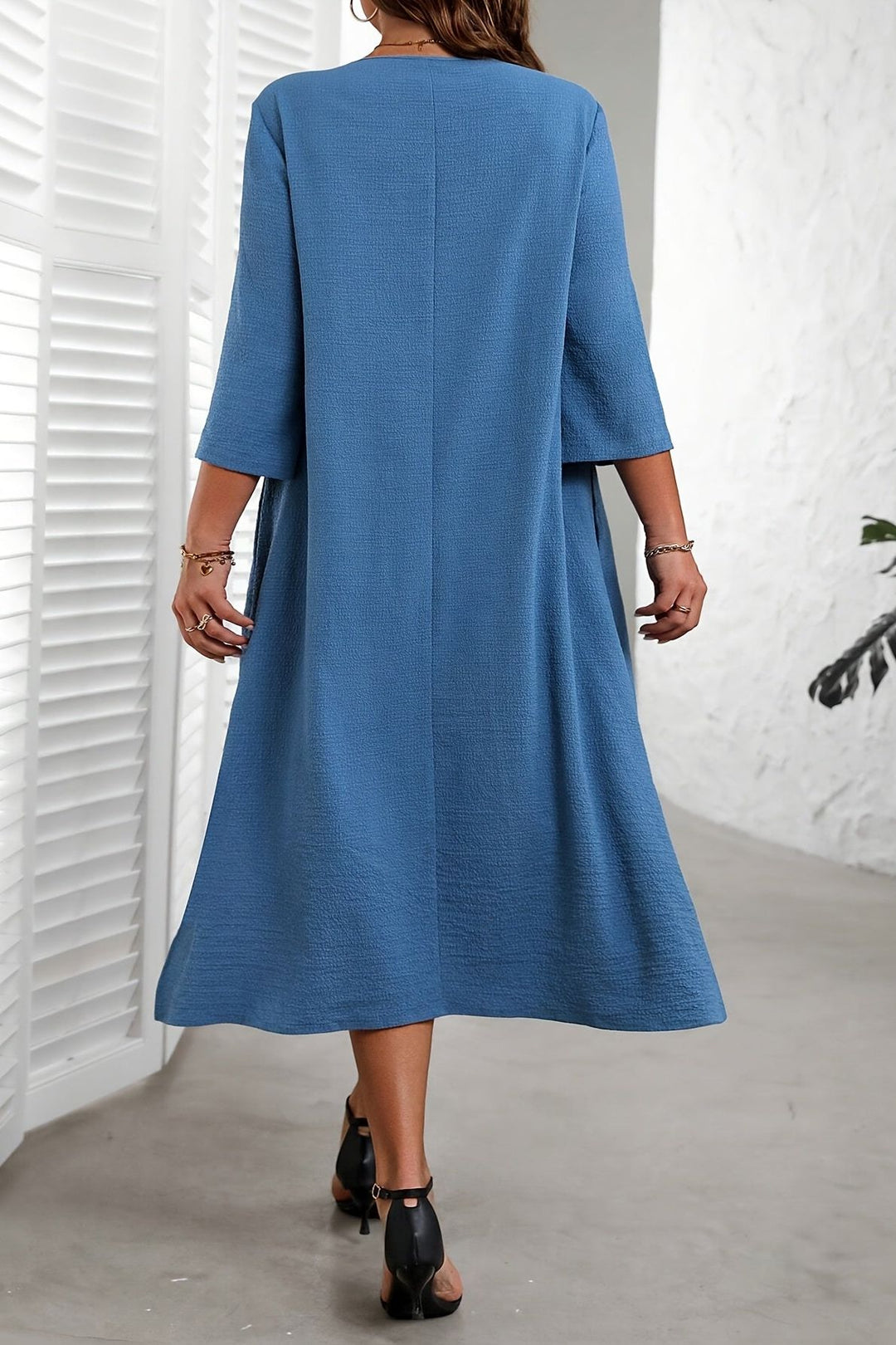 Stylish flowing midi dress for women, offering effortless elegance and comfort, ideal for versatile day or evening wear.