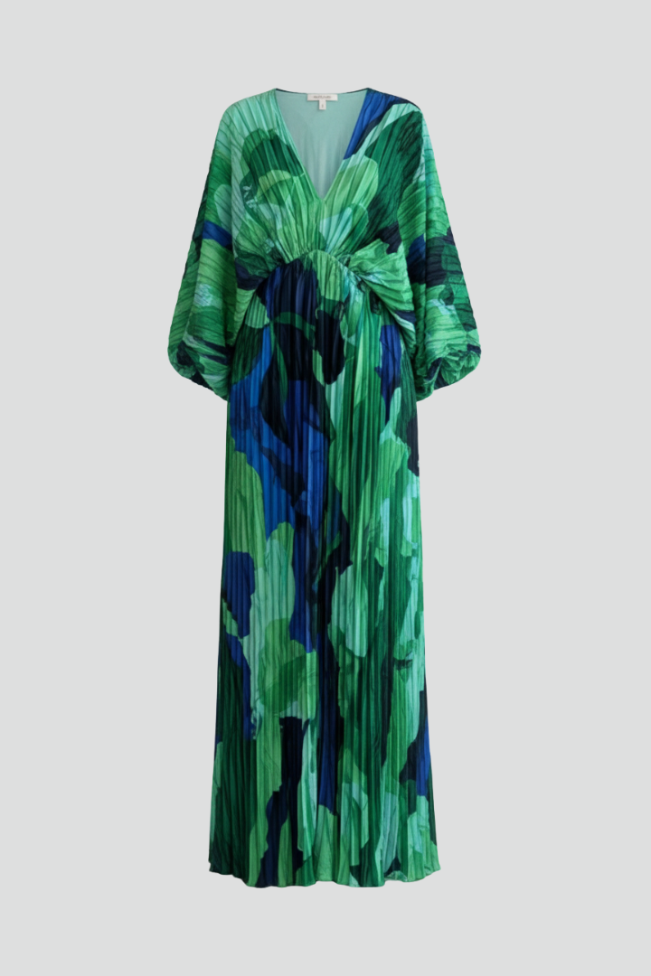 Elegant women's flowing pleated green maxi dress with V-neck and stylish side slit, perfect for evenings.
