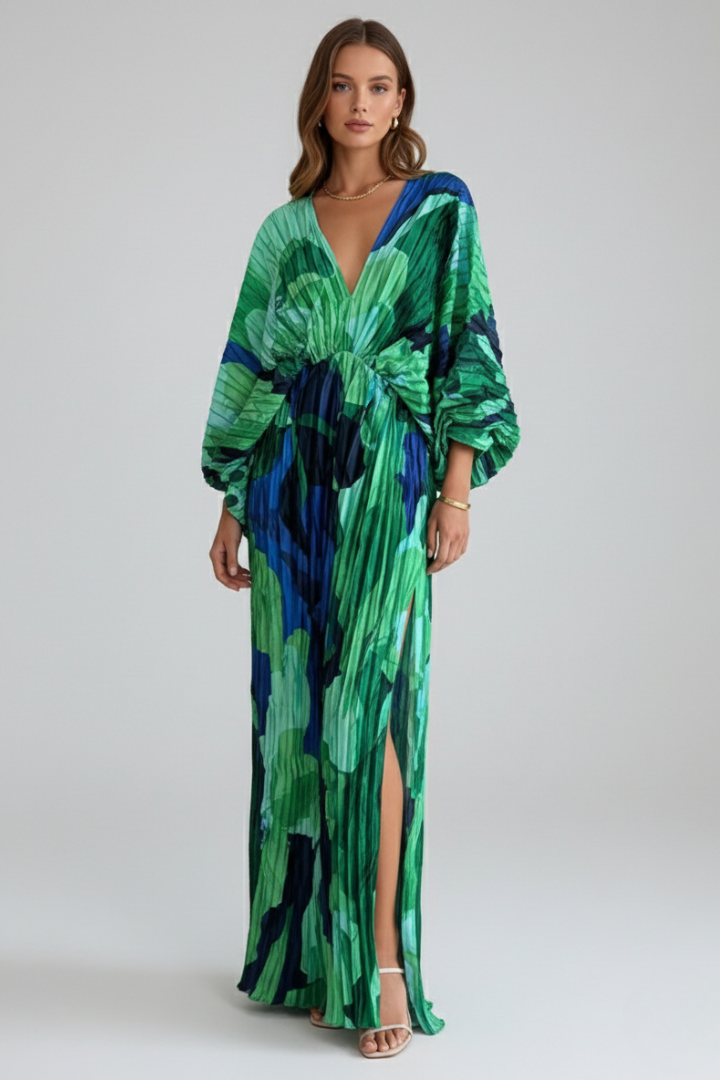Flowing green pleated maxi dress for women with V-neck, comfortable for summer vacations & casual wear.