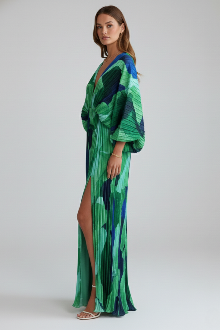 Graceful flowing green maxi dress for women, pleated, with V-neck & side slit, ideal for day to evening.