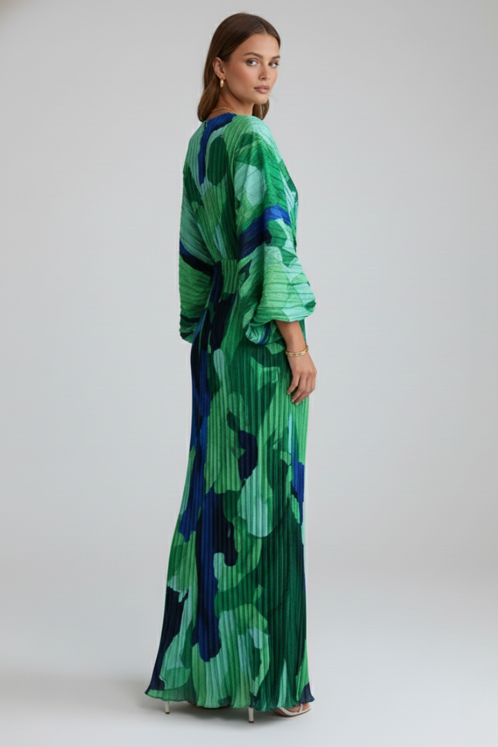 Stylish women's green V-neck pleated maxi dress with elegant side slit, a beautiful long summer vacation outfit.