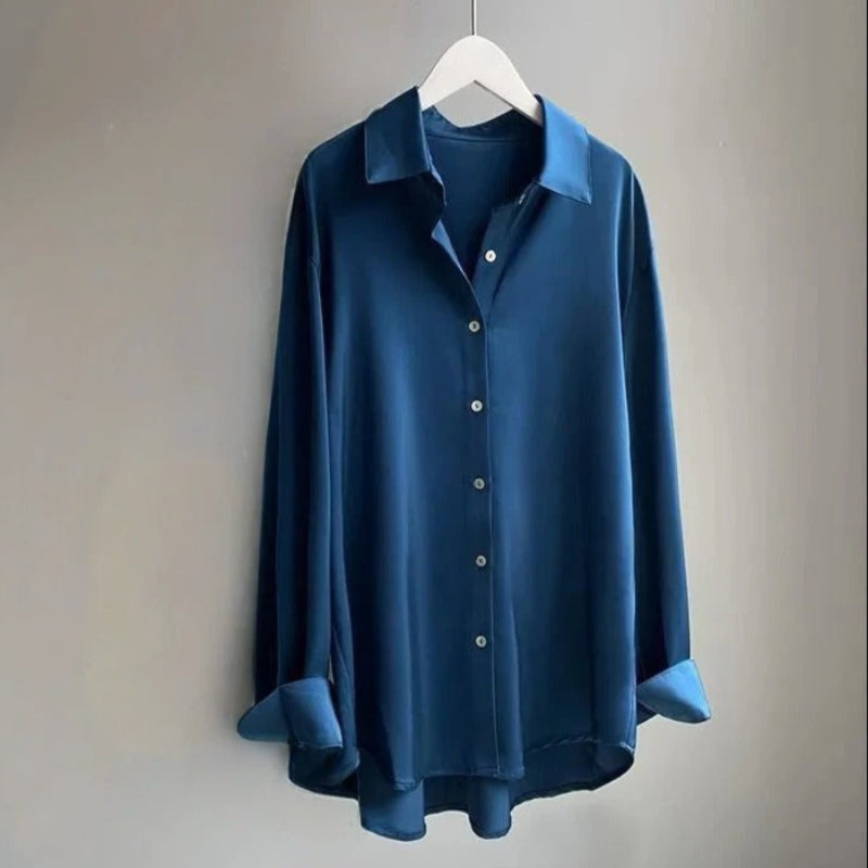 Chic women's flowy blouse, offering a comfortable fit and stylish apparel. Elegant long sleeve shirt.