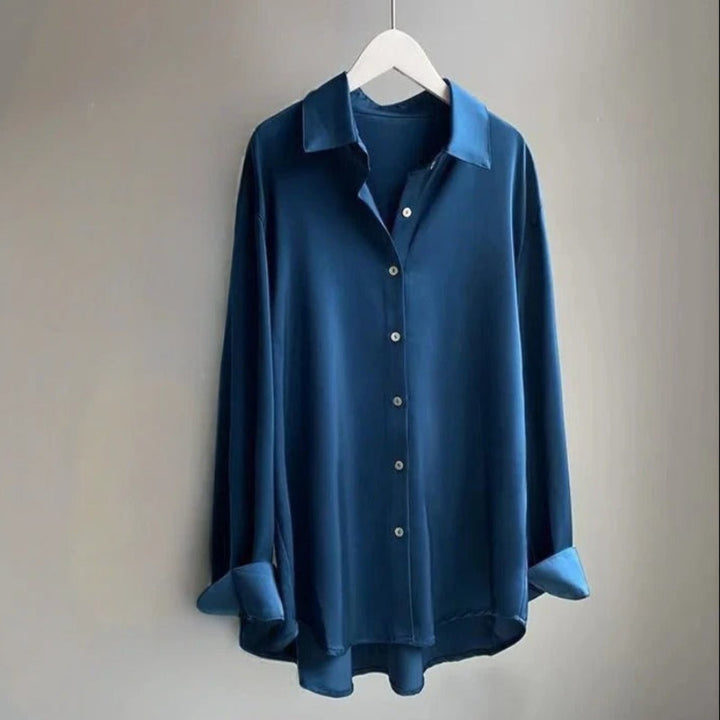 Chic women's flowy blouse, offering a comfortable fit and stylish apparel. Elegant long sleeve shirt.