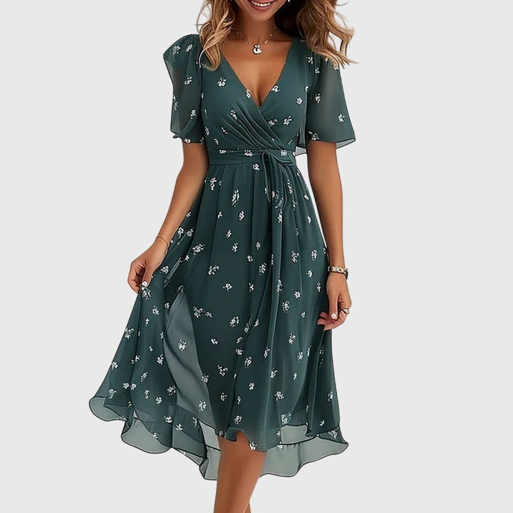 Chic V-neck midi dress for women, featuring elegant flutter sleeves & a comfortable flowy design, ideal for summer fashion.