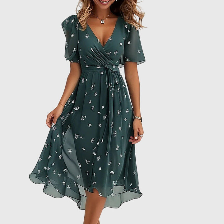 Sophisticated women's flowy midi dress with elegant V-neck and flutter sleeves, designed for versatile summer occasion wear.