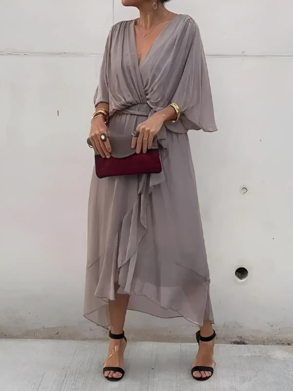 Chic women's flowy maxi dress with a V-neck and belt. A comfortable & elegant choice for casual outings or vacations.