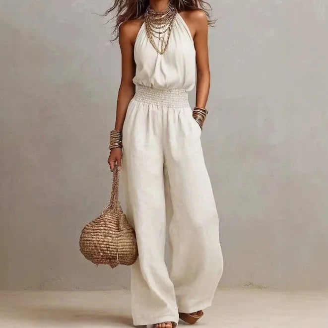 Detail of the soft, flowing fabric of a women's wide leg halter neck jumpsuit, showcasing comfort.
