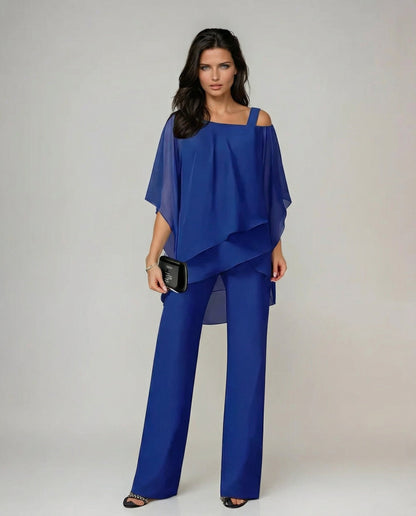 Comfortable women's fluid two-piece outfit. Features an elegant asymmetric top & wide leg pants for summer.