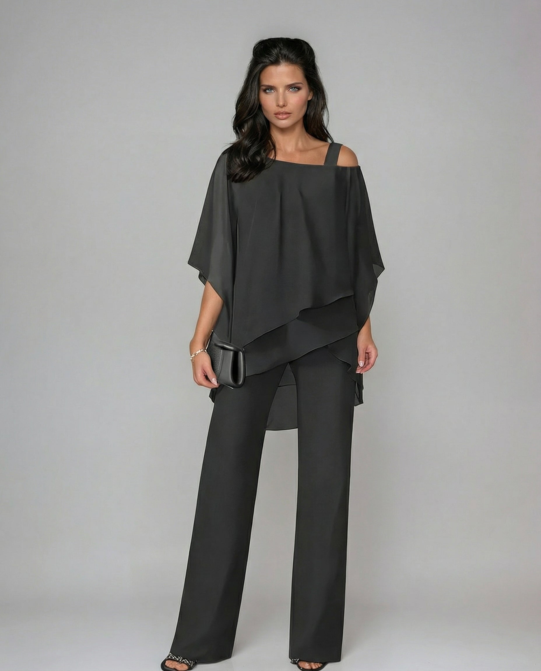 Soft, fluid two-piece women's outfit featuring an elegant asymmetric top & comfortable wide leg pants. Summer fashion.