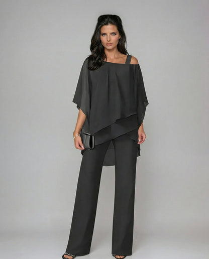 Soft, fluid two-piece women's outfit featuring an elegant asymmetric top & comfortable wide leg pants. Summer fashion.