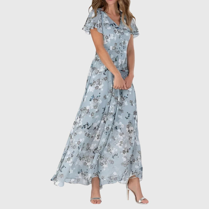 Printed women's flutter sleeve maxi dress, ideal for summer parties. A flowy V-neck casual and elegant dress.