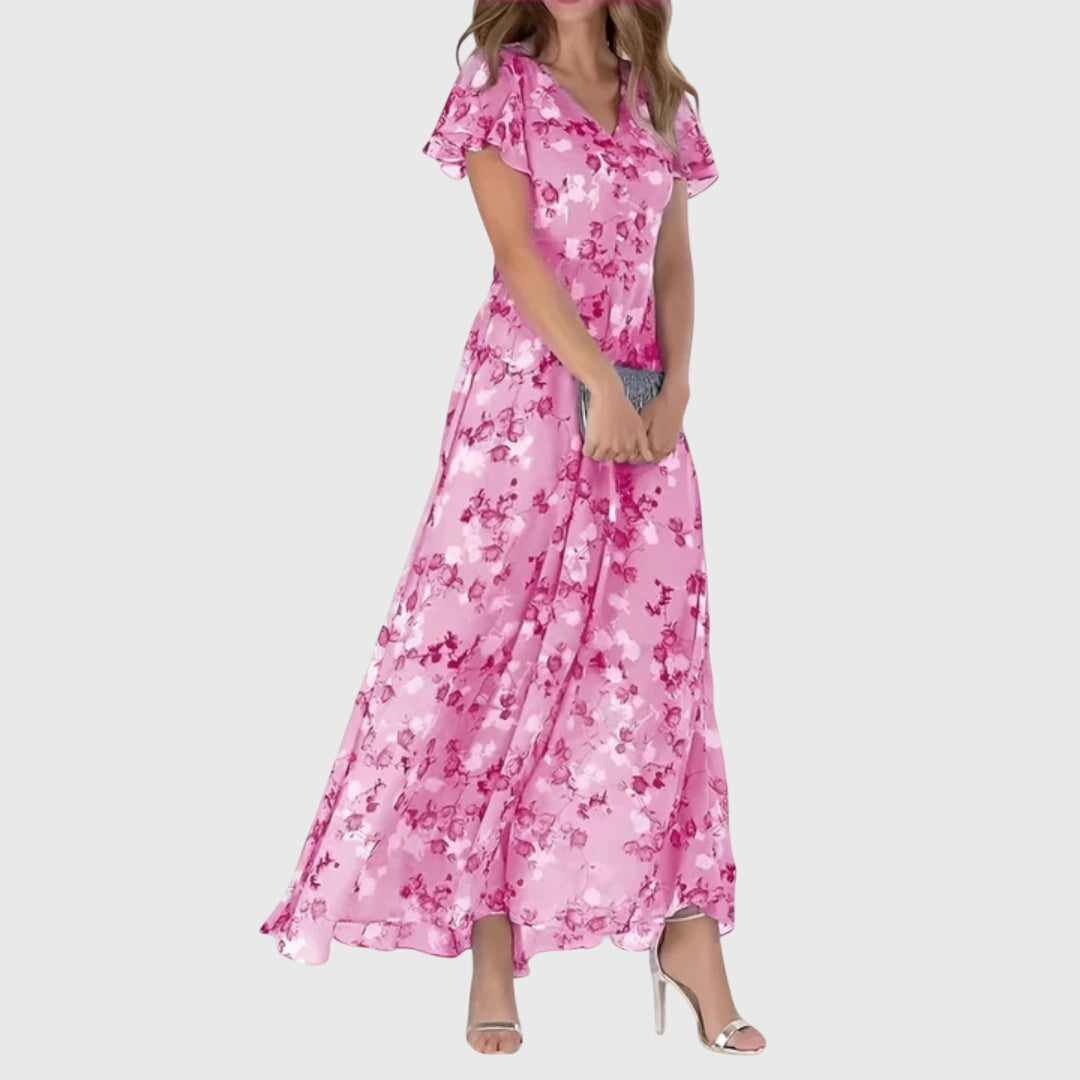 Stylish women's flutter sleeve maxi dress, elegant printed design for evening parties or summer events.