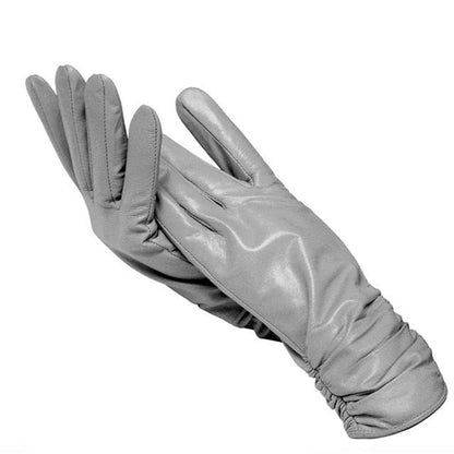 Stylish women's genuine leather driving gloves. Wrist-length, an elegant fashion accessory for winter wear.