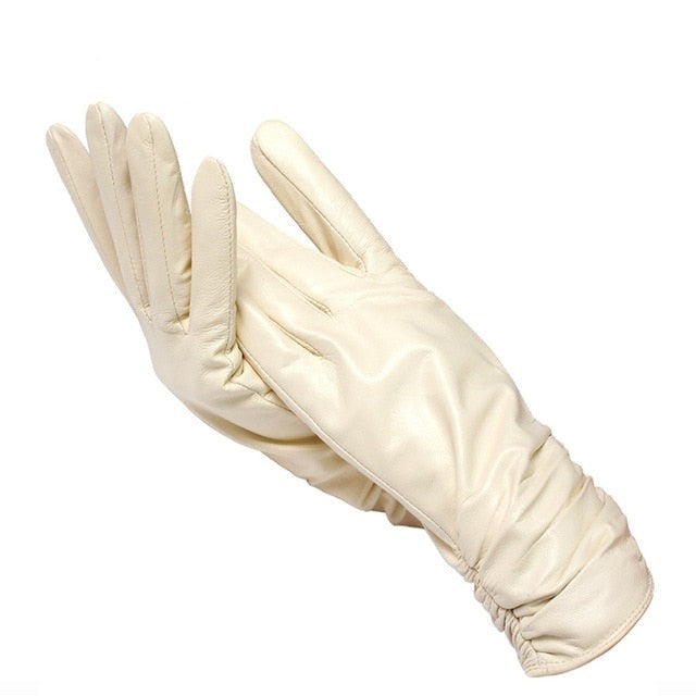 Premium genuine leather gloves for women. Soft, wrist-length winter wear, a luxurious and elegant accessory.