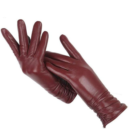 Sophisticated women's genuine leather gloves. Ideal wrist-length fashion accessory for driving or daily elegance.