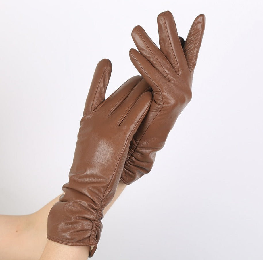 Luxurious women's genuine leather gloves. Elegant wrist-length winter wear, a premium and stylish accessory.