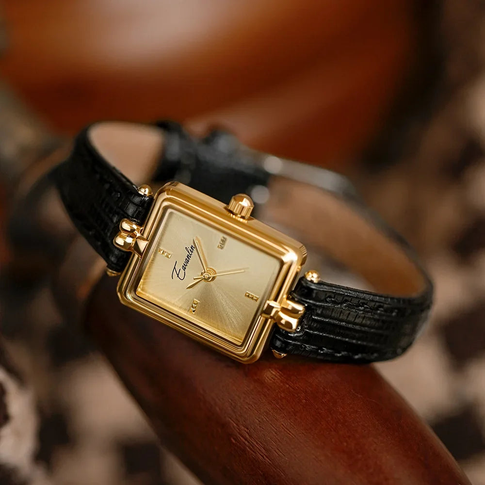 Modern women's black rectangle watch, an elegant accessory with sleek gold-tone accents, perfect for daily wear.