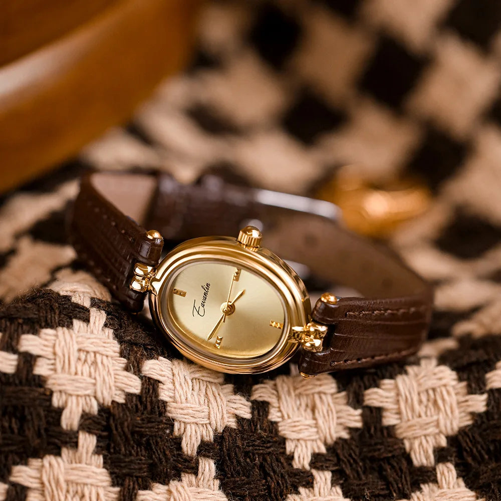 Stylish women's gold-tone accessory, an elegant wristwatch with a refined dial, showcasing modern craftsmanship.