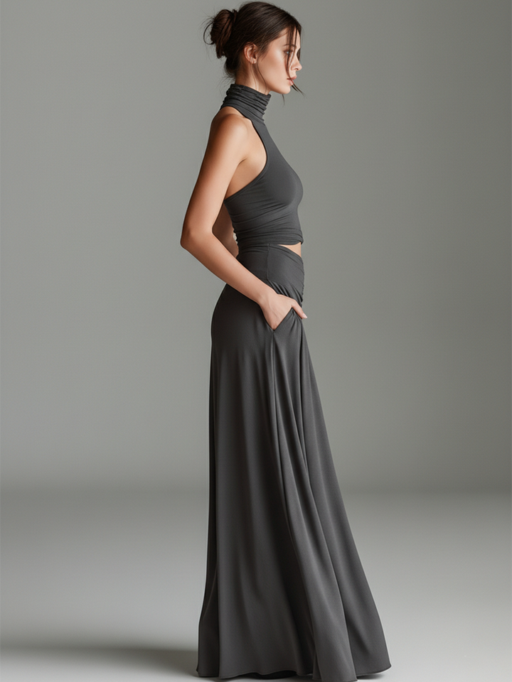 Sleek gray maxi dress for women, with a high turtleneck halter neckline and stylish cutout waist detail.
