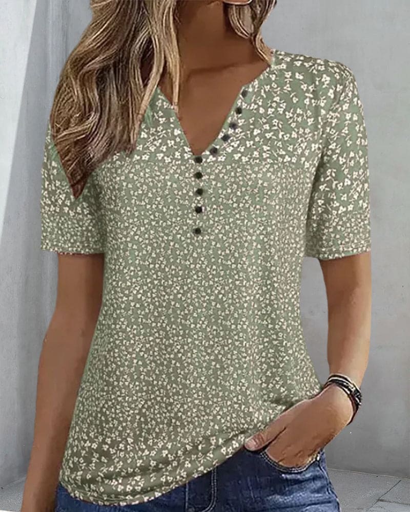 Stylish women's green floral short-sleeve shirt, an elegant blouse for summer fashion and spring style.