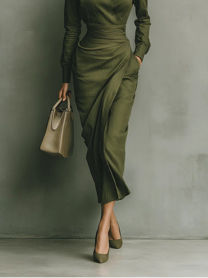 Sophisticated women's green wrap dress, elegant midi length with long sleeves, ideal for versatile styling.