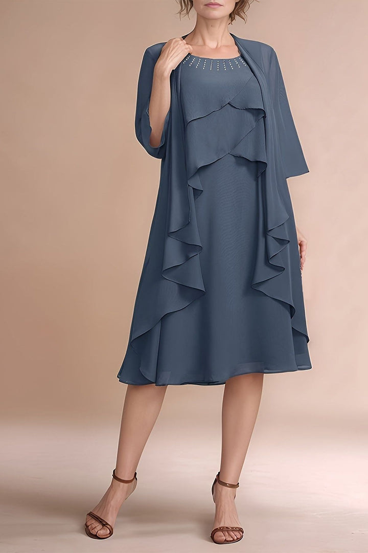 Elegant women's grey pleated midi dress, perfect for formal events & special occasions. Graceful and timeless style.