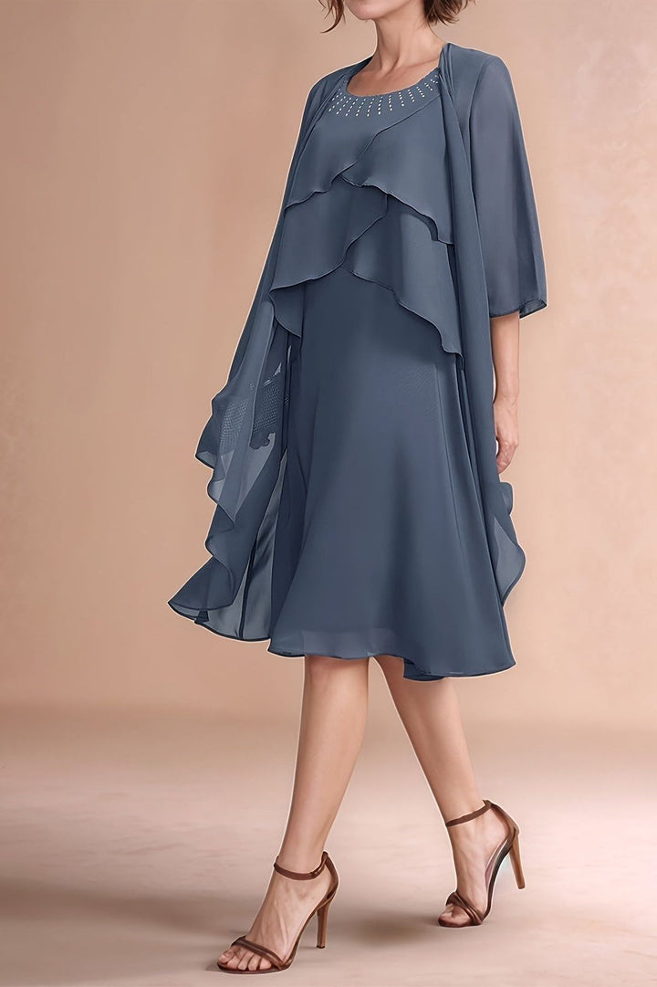 Graceful women's pleated midi dress in a timeless grey shade, ideal for evening wear & elegant occasions.