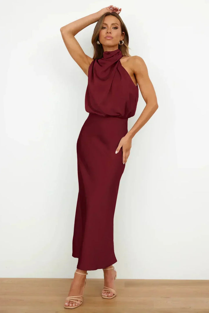 Sophisticated women's long formal dress, a halter neck, open-back, floor-length evening gown.
