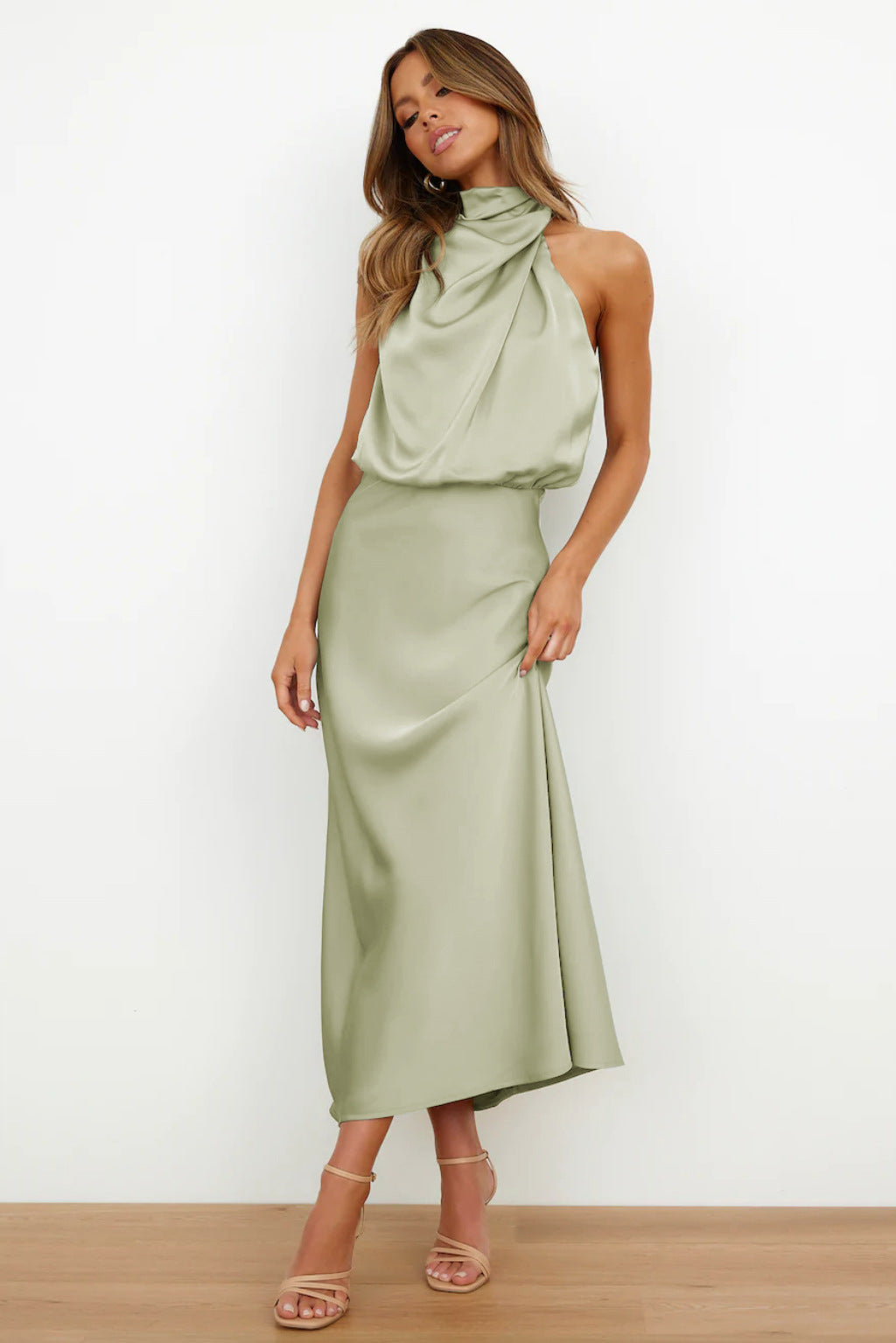 Stunning open-back halter gown for women, a sophisticated floor-length special occasion dress.