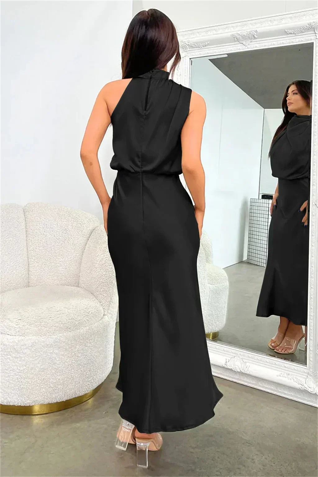 Stunning women's floor-length party dress, an elegant halter design with a captivating open back.