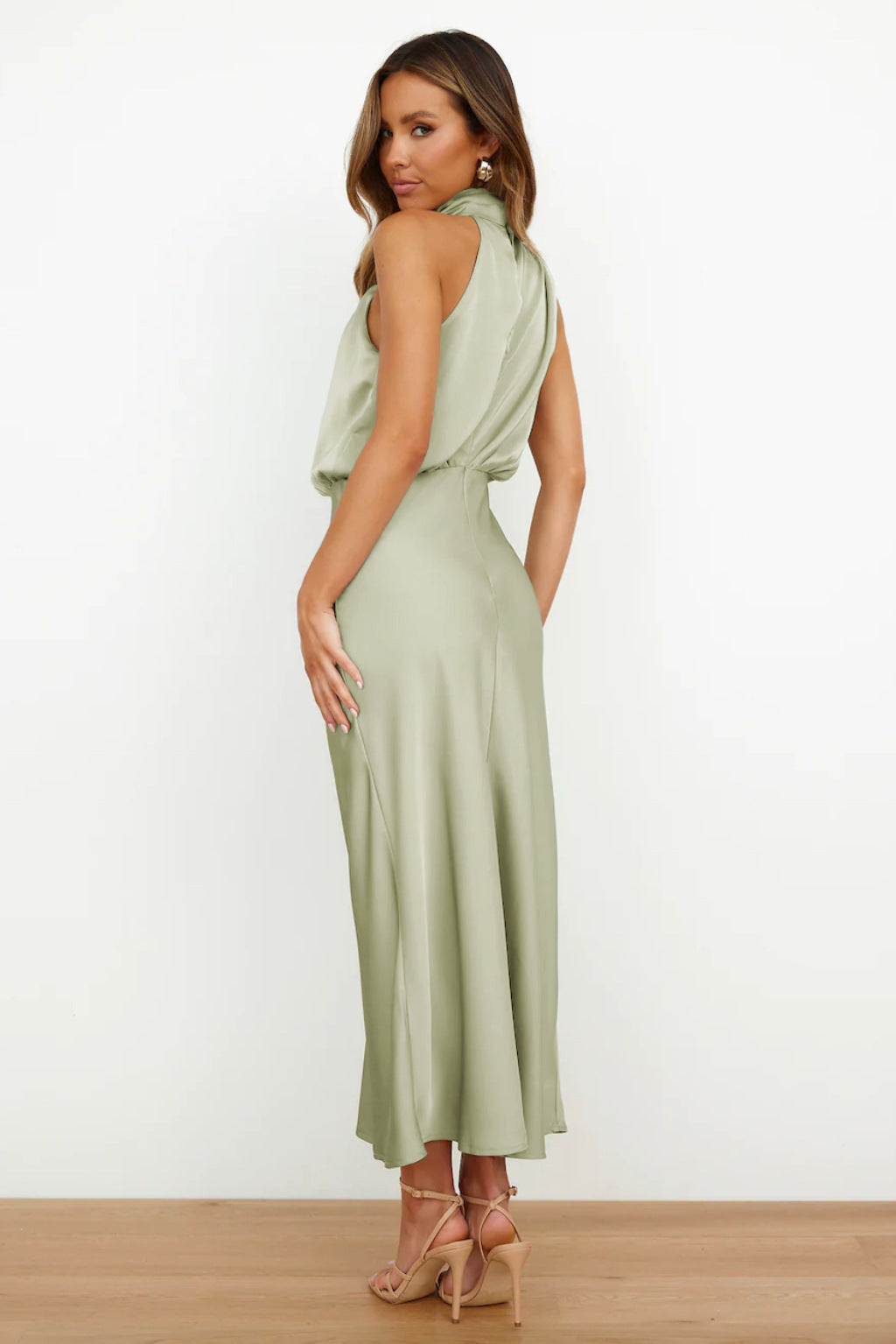 Women's formal halter dress with a graceful floor-length silhouette, ideal for wedding guests.