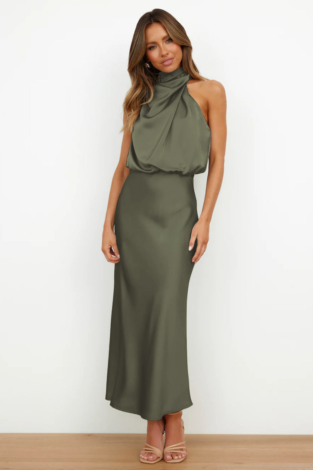 Close-up of the halter neckline on a sophisticated women's formal evening gown.